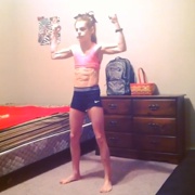 15 years old Cheerleader Lexie Flexing muscles