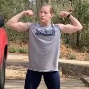 17 years old Powerlifter Claire Flexing muscles