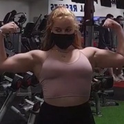 15 years old Powerlifter Rhian Flexing biceps