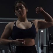 18 years old Powerlifter Emily Flexing muscles