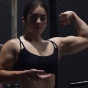 19 years old Powerlifter Emily Flexing muscles