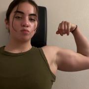 19 years old Powerlifter Emily Flexing biceps