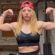 16 years old Powerlifter Aubrey Flexing muscles