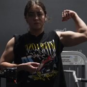18 years old Powerlifter Emily Flexing muscles