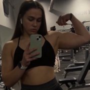 18 years old Powerlifter Joy Flexing biceps