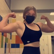 16 years old Powerlifter Abigail Flexing muscles