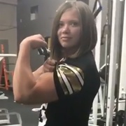 18 years old Figure Fitness Hanna Flexing biceps